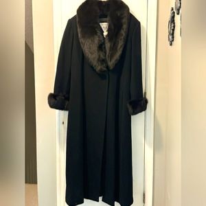 Ladies black wool coat with real fur collar and sleeve.